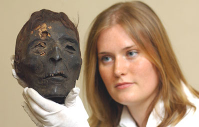 This mummy's head, dating back thousands of years, is being scanned by specialists at a North East hospital to find out how its owner died.